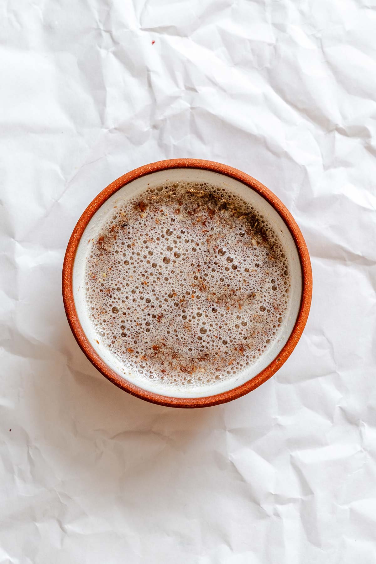 Process shot showing flaxseed mixture in a bowl.