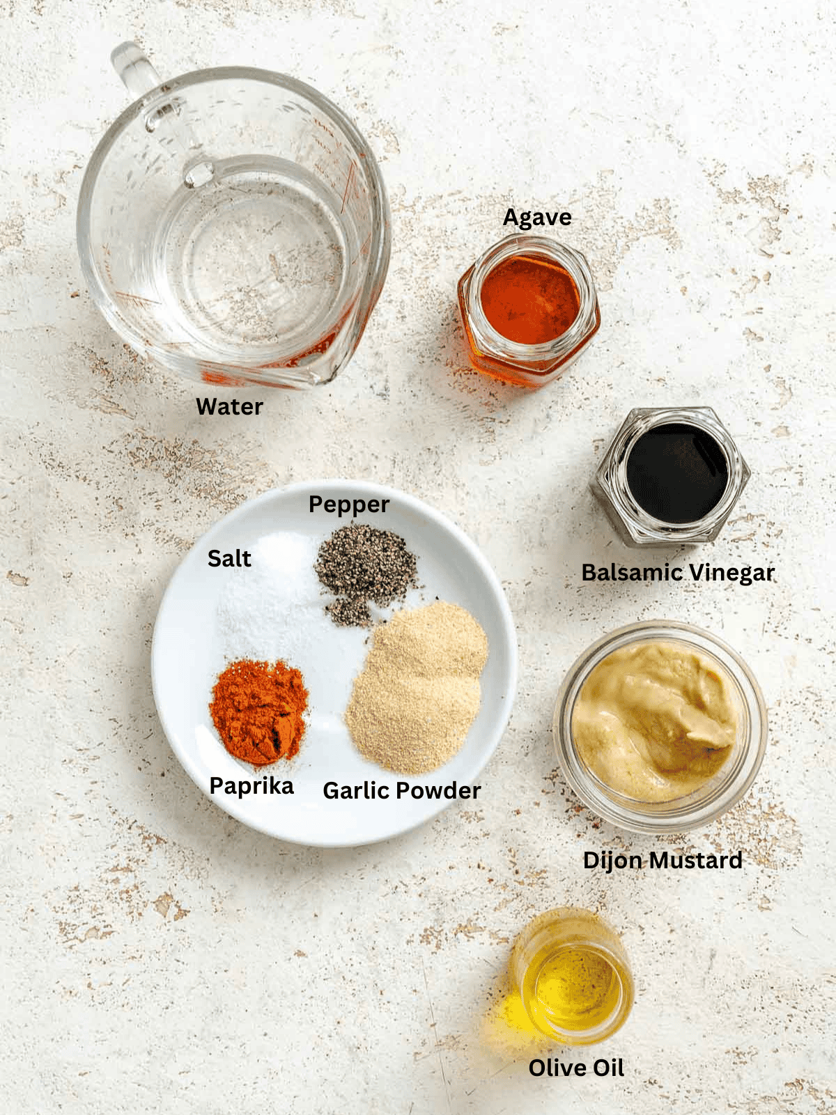 Ingredients for Spinach Salad Dressing measured out on a white surface. 