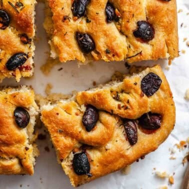 Completed Vegan Focaccia (Garlic and Herb) on a white surface.