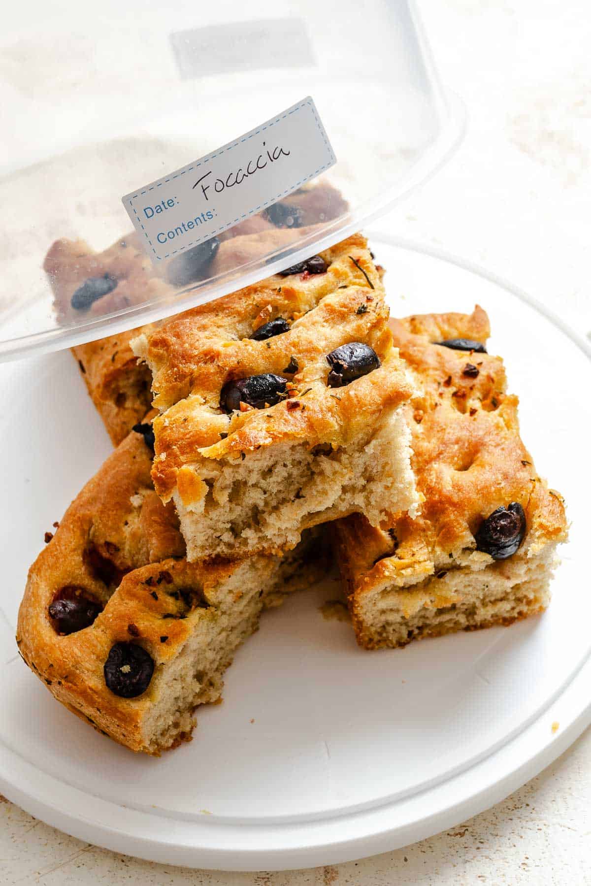 Completed Vegan Focaccia (Garlic and Herb) in a storage container.