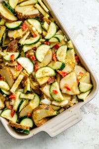 Process shot showing ingredients added to baking dish.