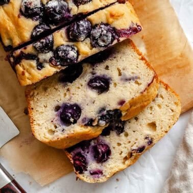 Completed Easy Blueberry Bread [Quick Bread!] on a cutting board.