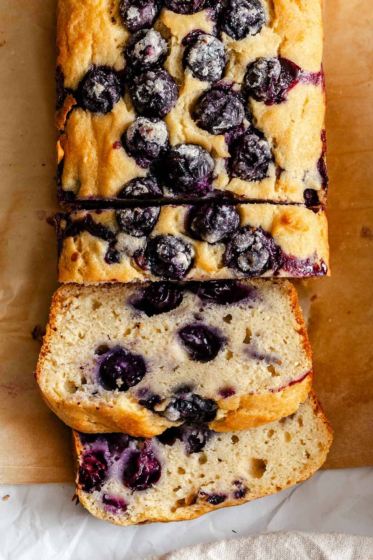 Completed Easy Blueberry Bread [Quick Bread!] on a cutting board.