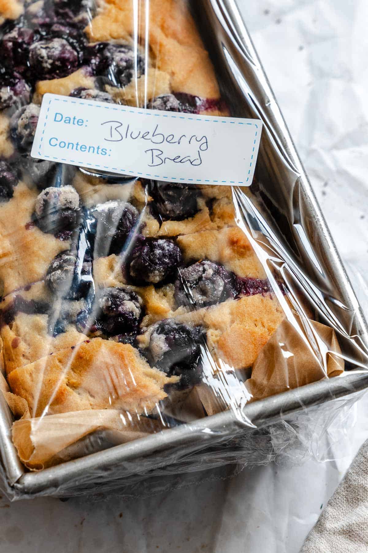 Completed Easy Blueberry Bread [Quick Bread!] in a storage container.