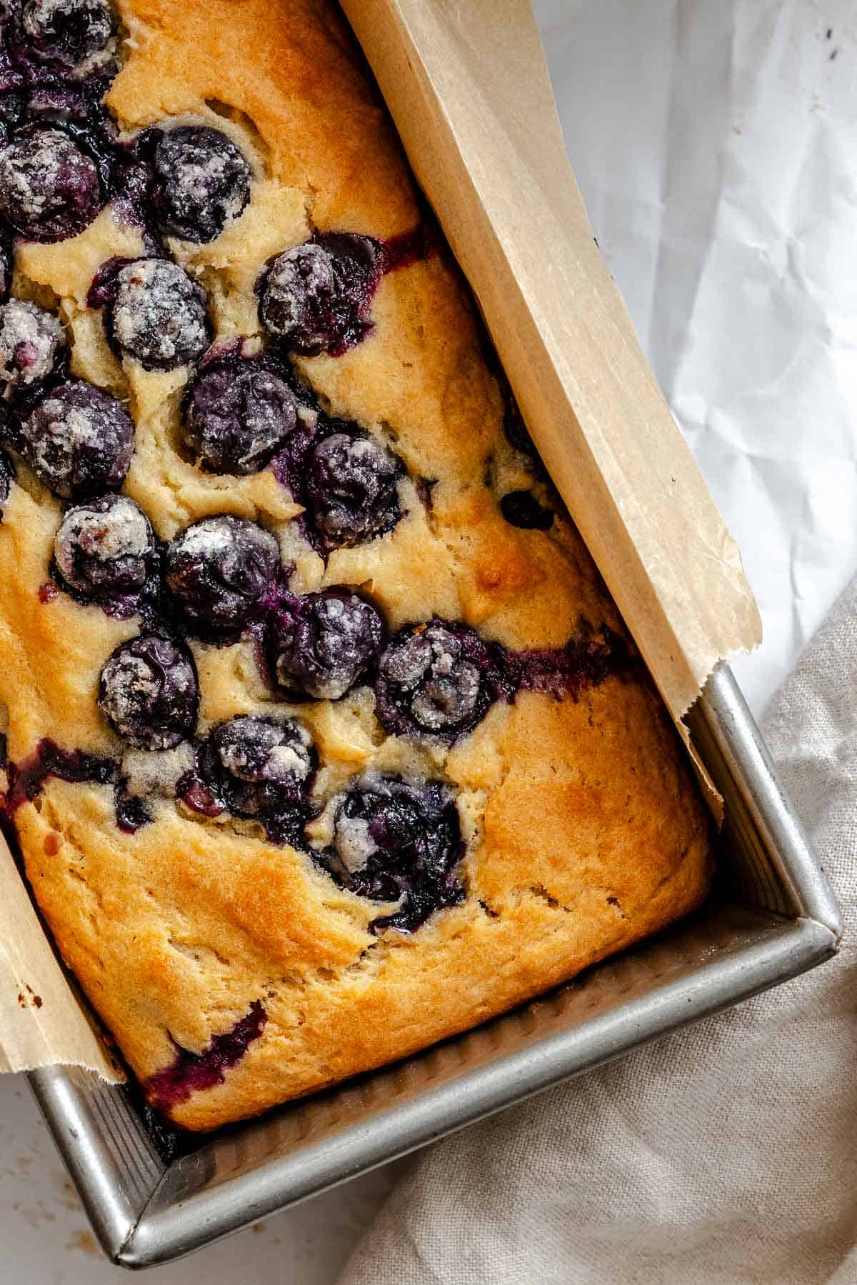 Completed Easy Blueberry Bread [Quick Bread!] in a bread pan.