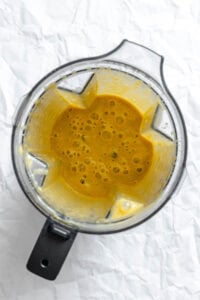 Process shot showing ingredients in a blender post blending.