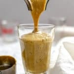 Completed Easy Pumpkin Smoothie being poured into a glass.