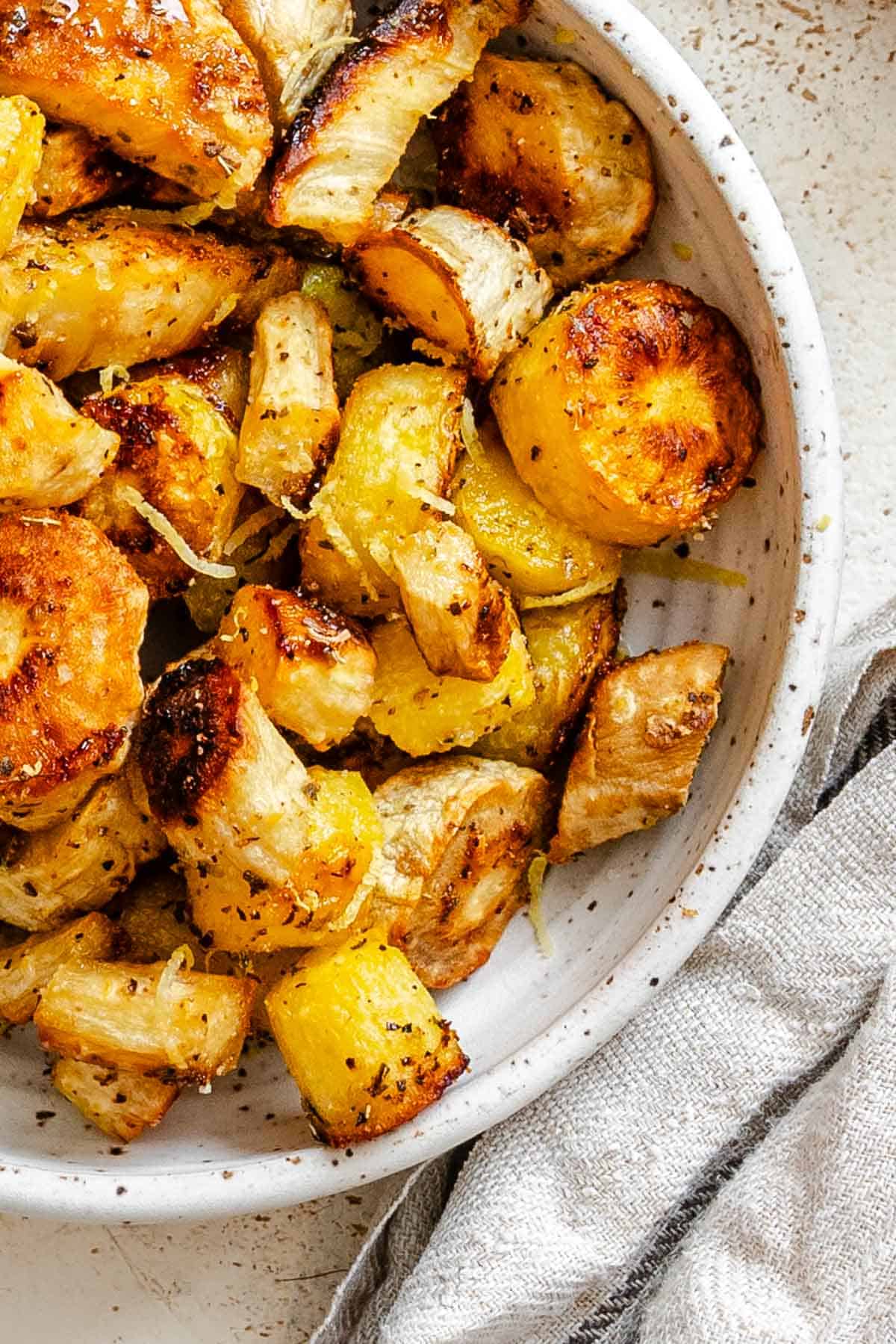 Completed Roasted Parsnips in a bowl.