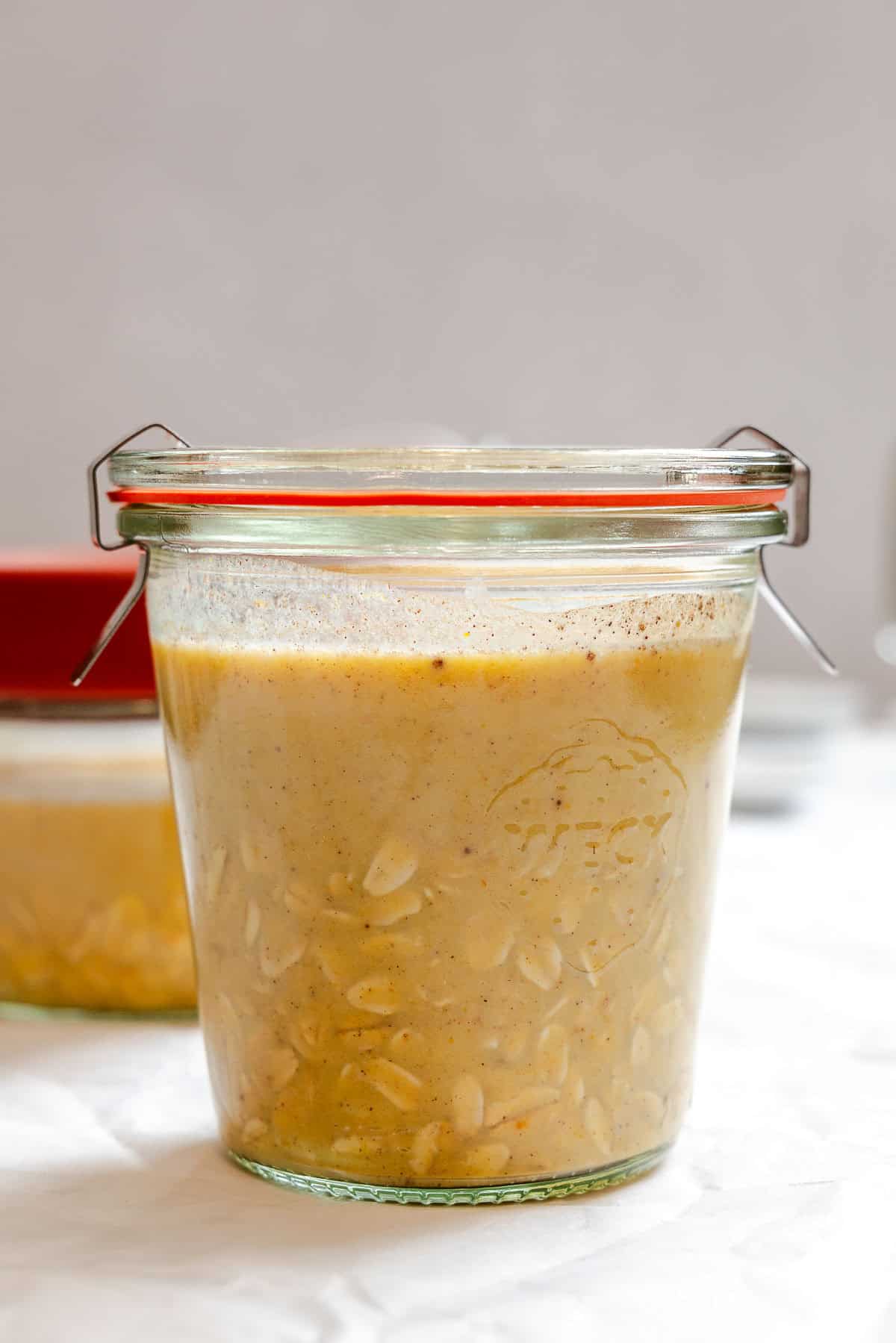 Process shot showing oats in storage jar.