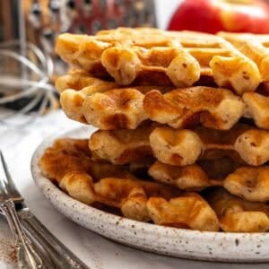 Completed Apple Cinnamon Waffles (Eggless) stacked on a plate.