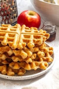 Completed Apple Cinnamon Waffles (Eggless) stacked on a plate.