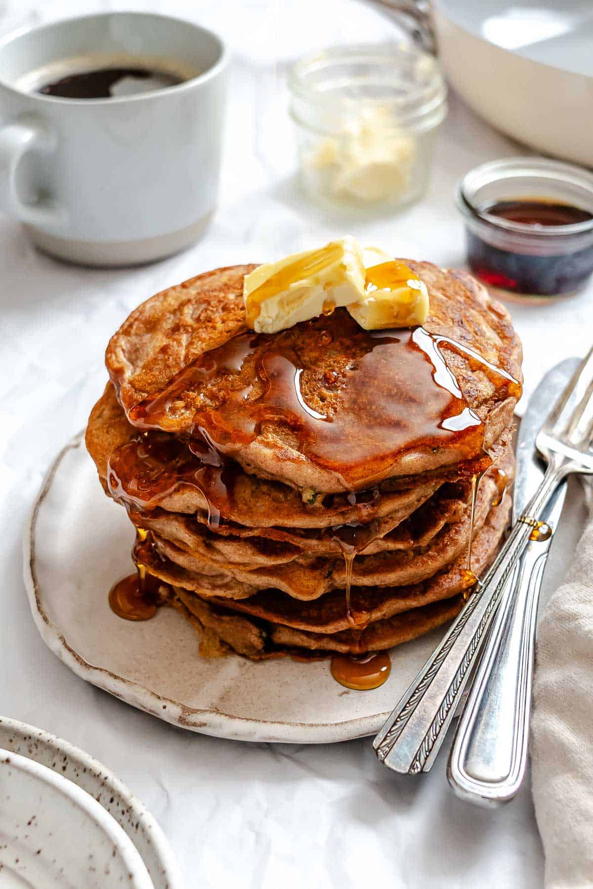 Completed stack of Carrot Cake Pancakes on a plate.