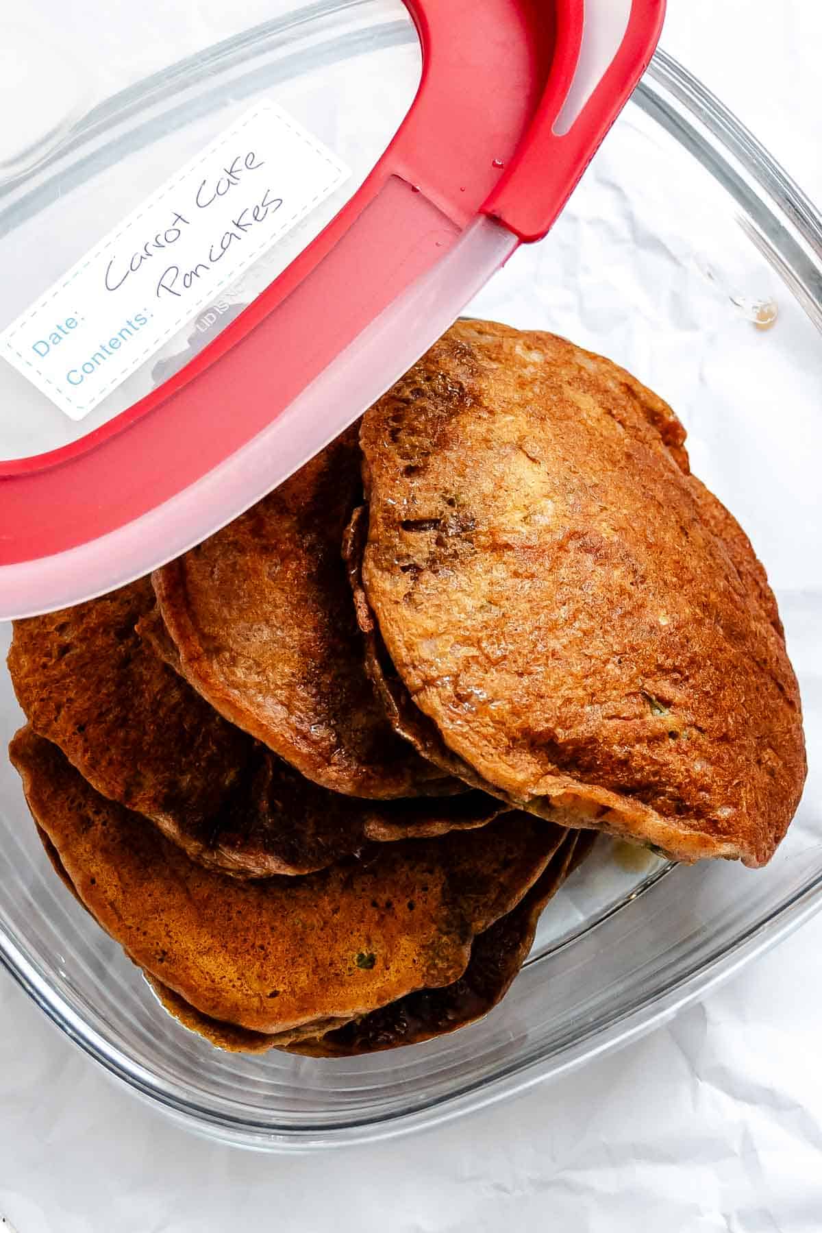 Completed Carrot Cake Pancakes in a storage container.