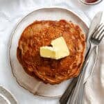 Completed stack of Carrot Cake Pancakes on a plate.