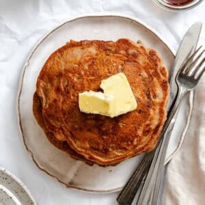Completed stack of Carrot Cake Pancakes on a plate.