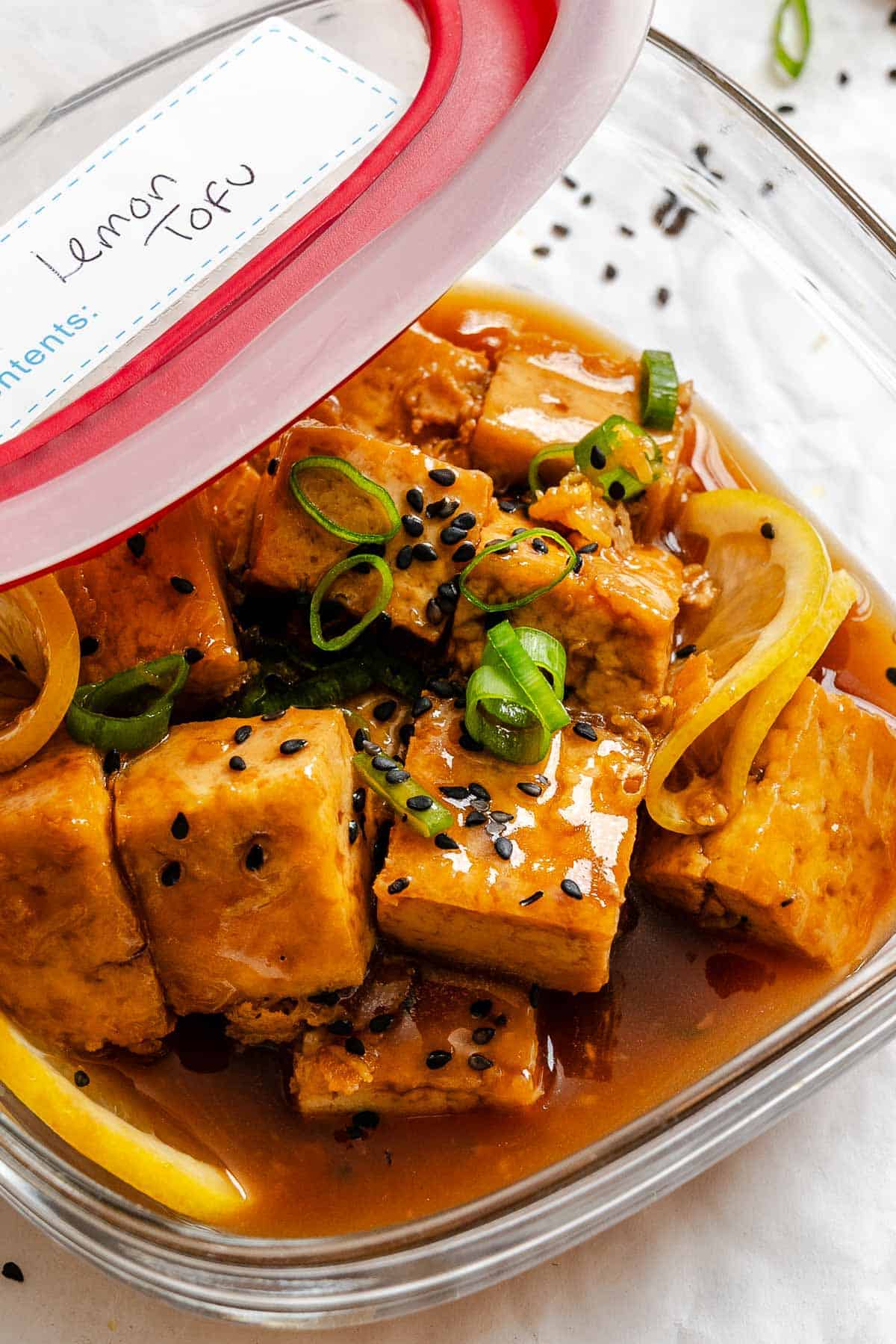 Completed Sticky Lemon Tofu in a storage container.