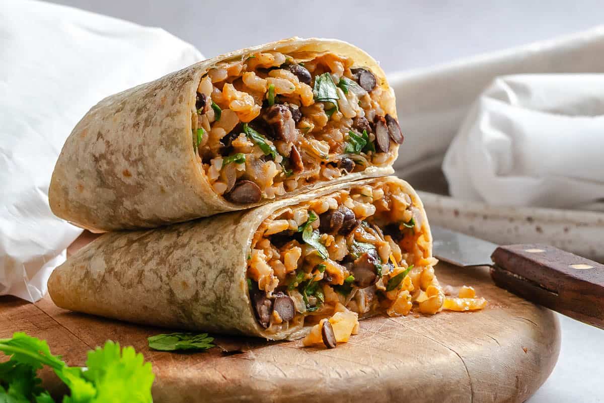 Two completed Rice and Black Bean Burrito (Freezer Friendly) stacked on one another.