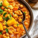 Completed Chickpea Stew in a bowl on a white surface.