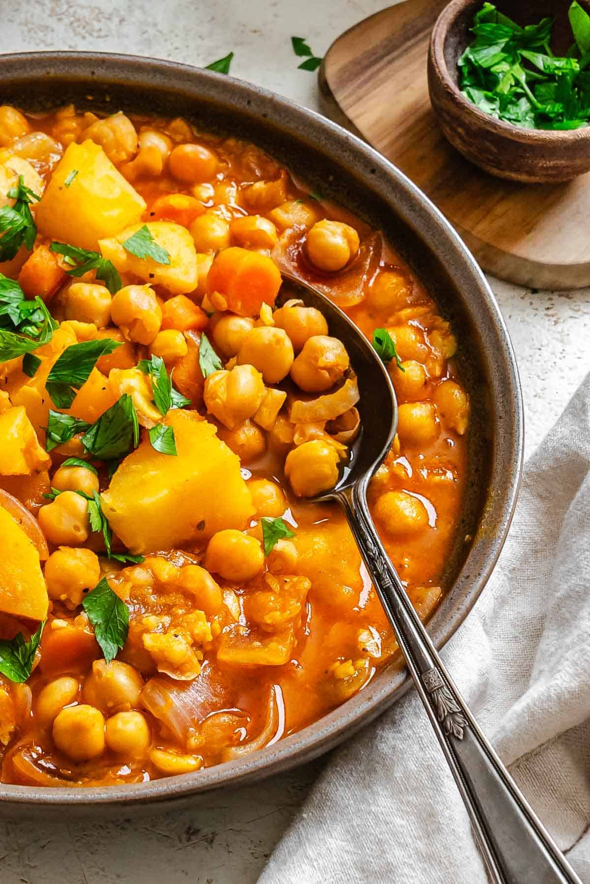 Completed Chickpea Stew in a bowl on a white surface.