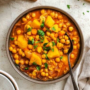 Completed Chickpea Stew in a bowl on a white surface.