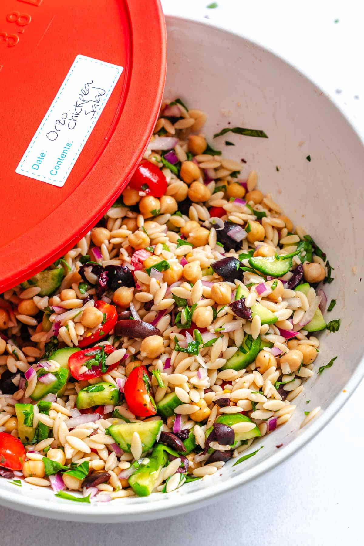 Completed Easy Lemon Orzo Salad in a storage container.