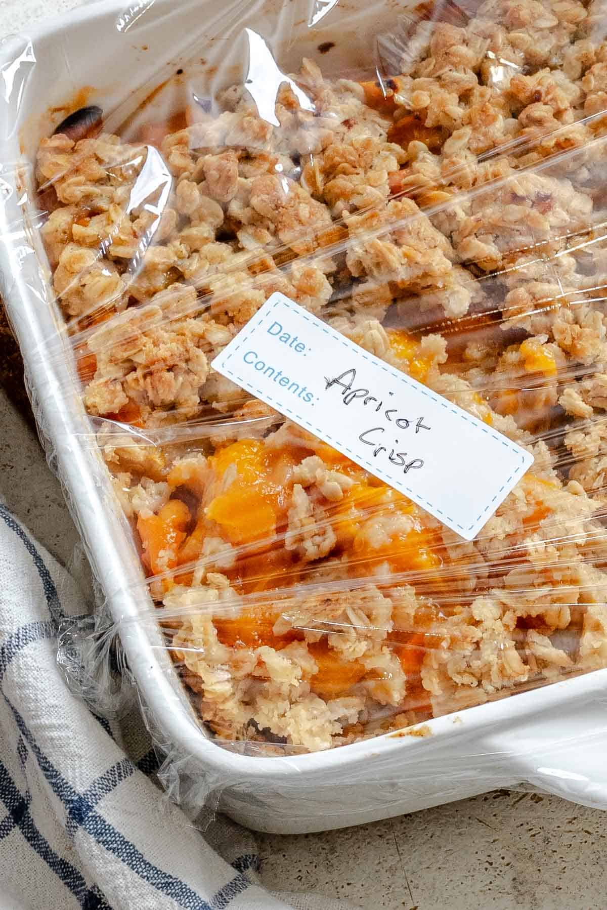 Completed Easy Apricot Crumble (With Oats) in storage container.
