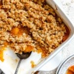 Completed Easy Apricot Crumble (With Oats) in baking dish and plate.
