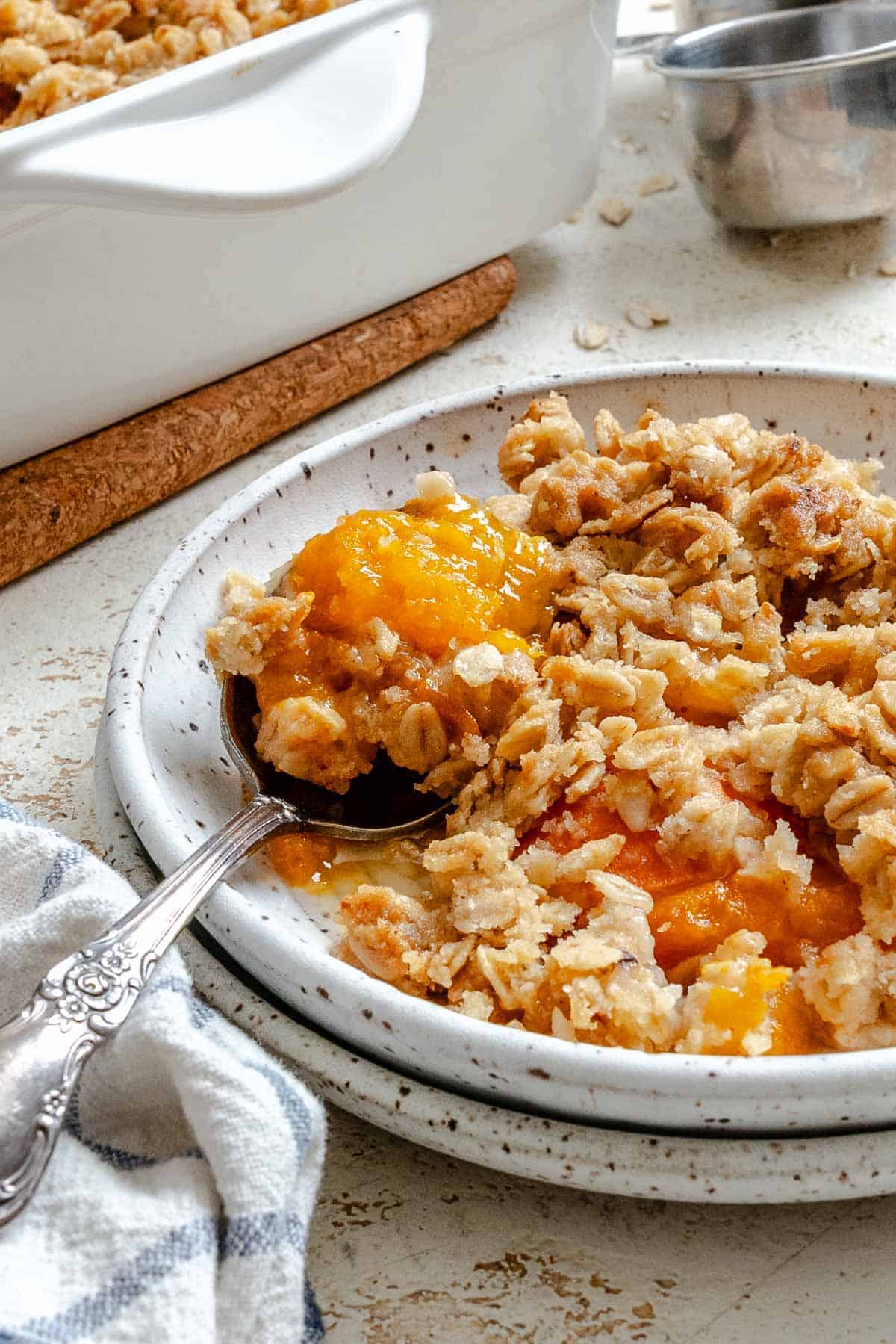 Completed Easy Apricot Crumble (With Oats) on a plate.