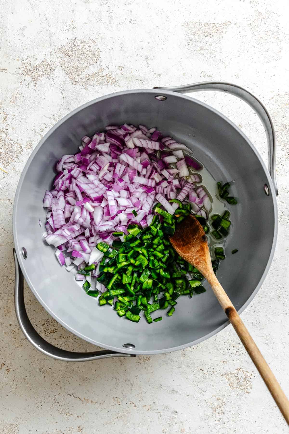 Process shot showing mixing ingredients in a pot.