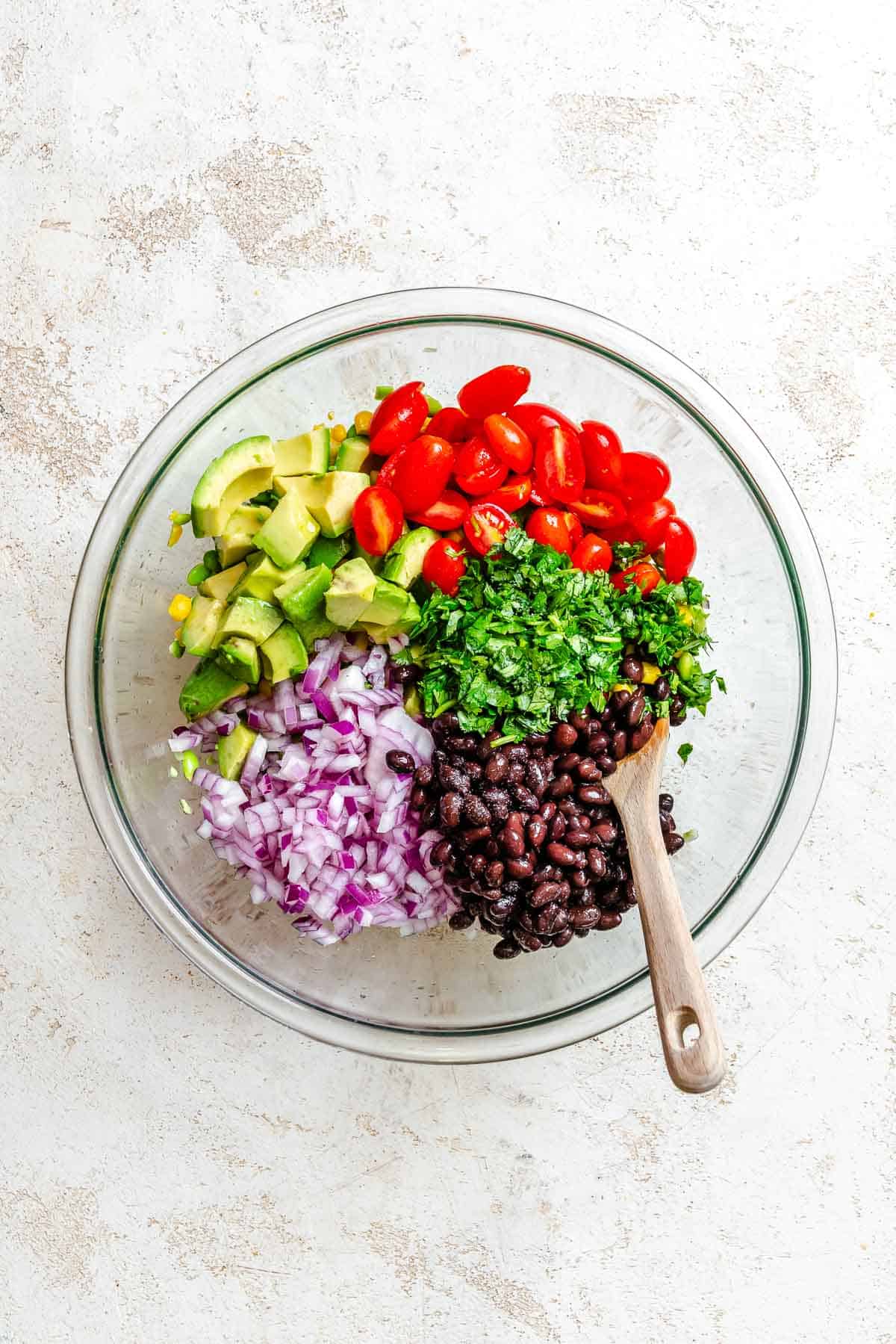 Process shot showing ingredients mixed in a bowl.