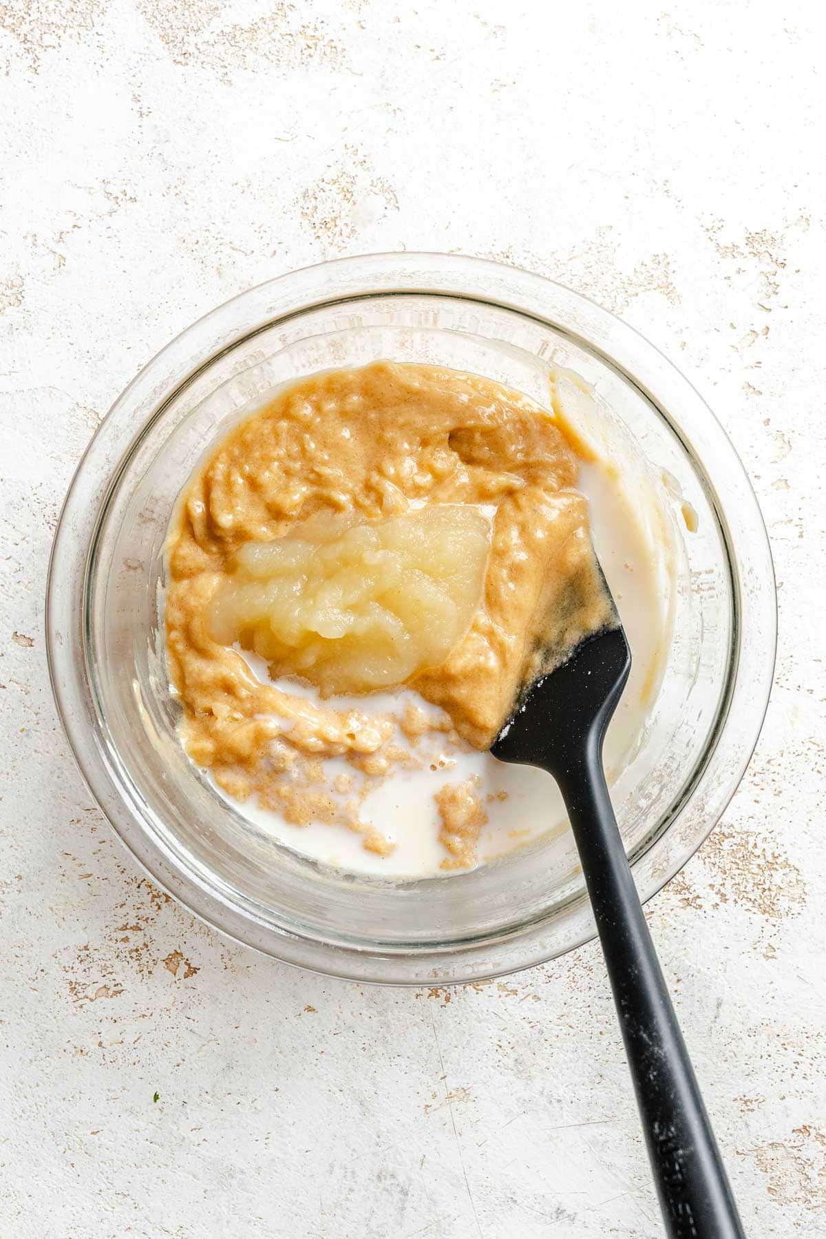 Process shot showing mixing ingredients in a bowl.