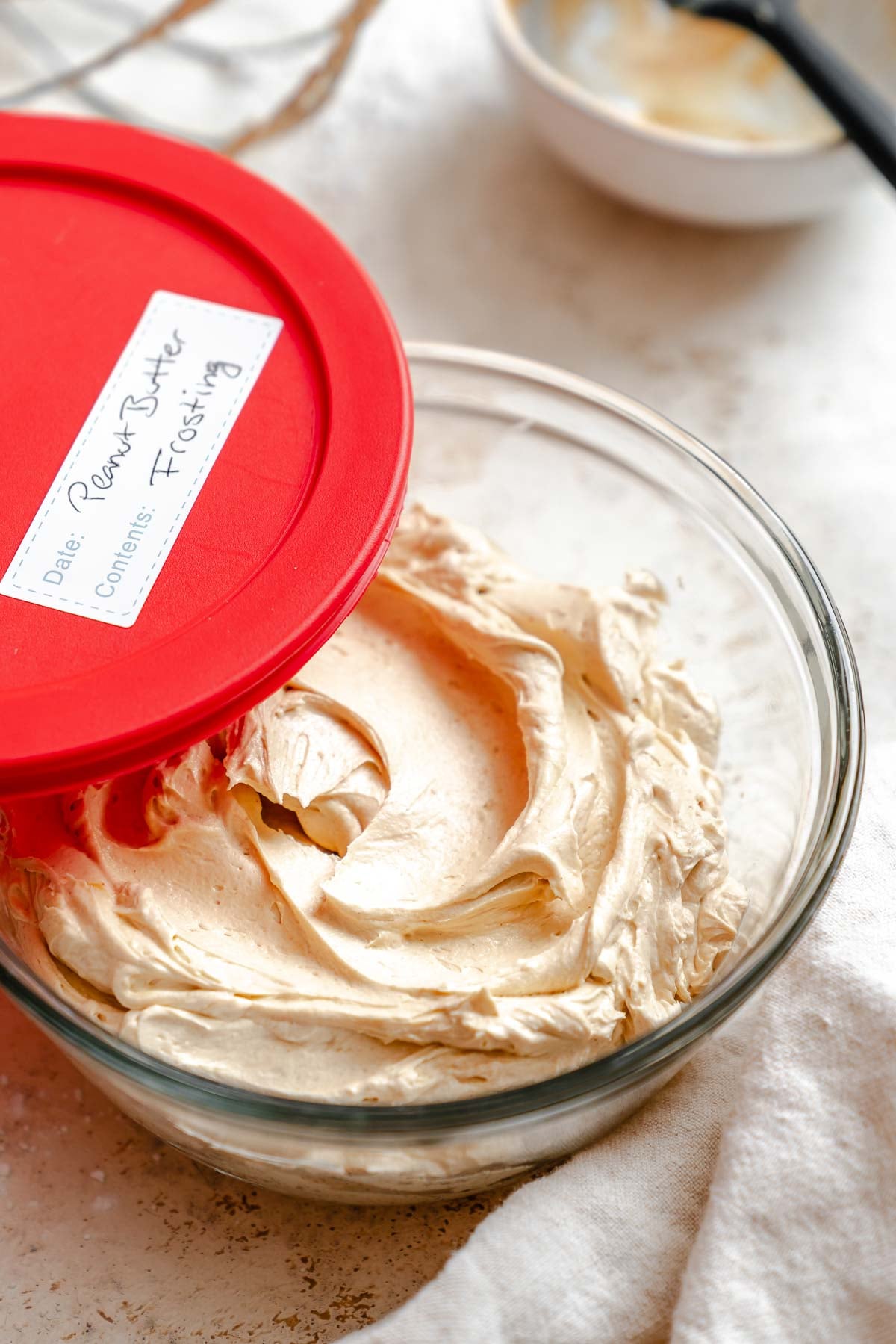 Completed Easy Peanut Butter Frosting in storage container.