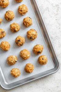 Process shot showing balls formed onto baking sheet.
