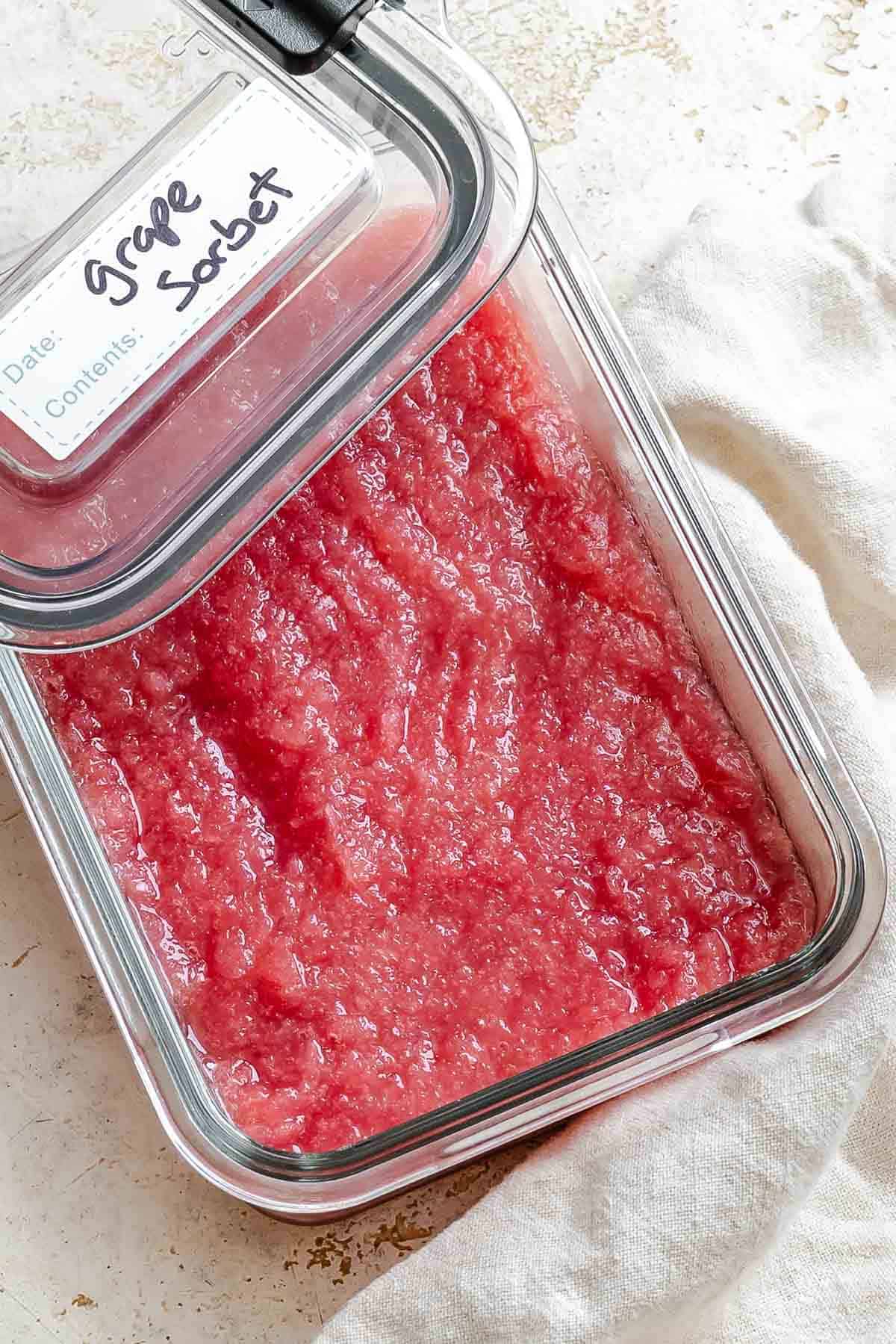 Completed Easy Grape Sorbet (Red or Green) in a storage container.
