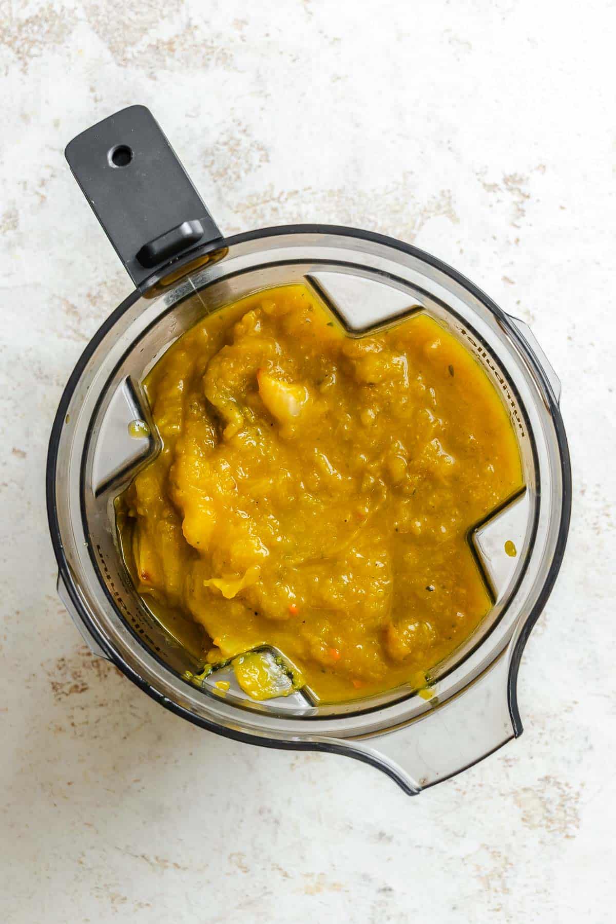 Process shot showing ingredients added to a blender.