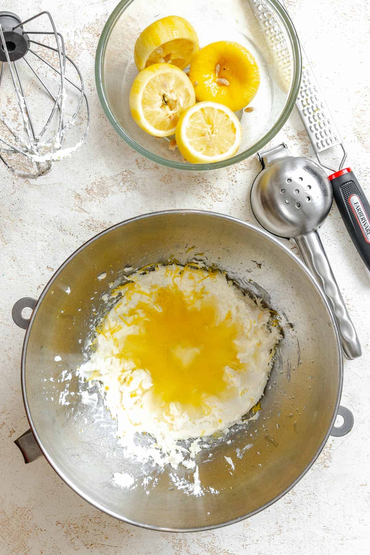 Process shot showing mixing ingredients together in a bowl.