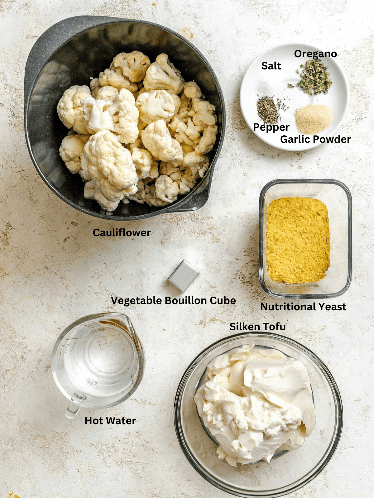 Ingredients for Cauliflower Alfredo Sauce (Vegan) measured out on a white surface.