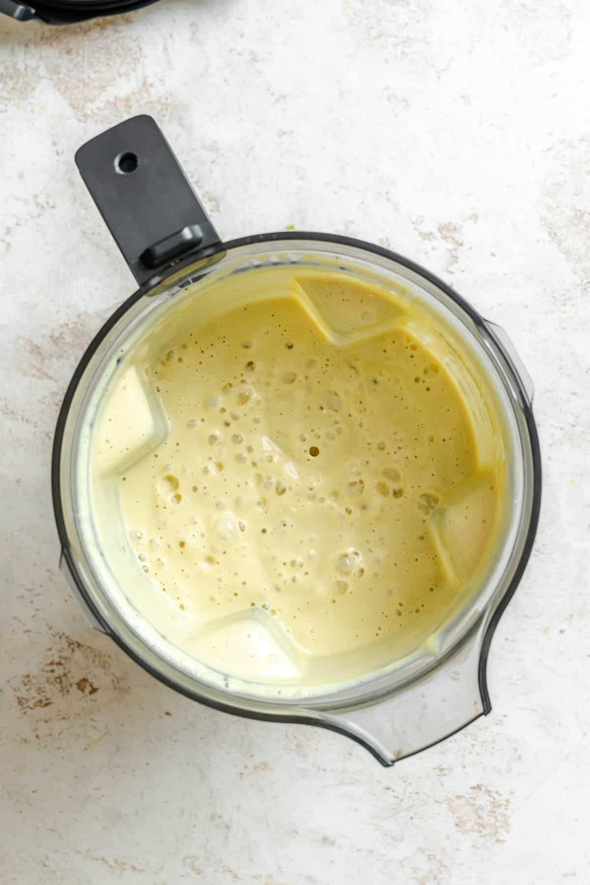 Process shot showing post blended ingredients in blender.
