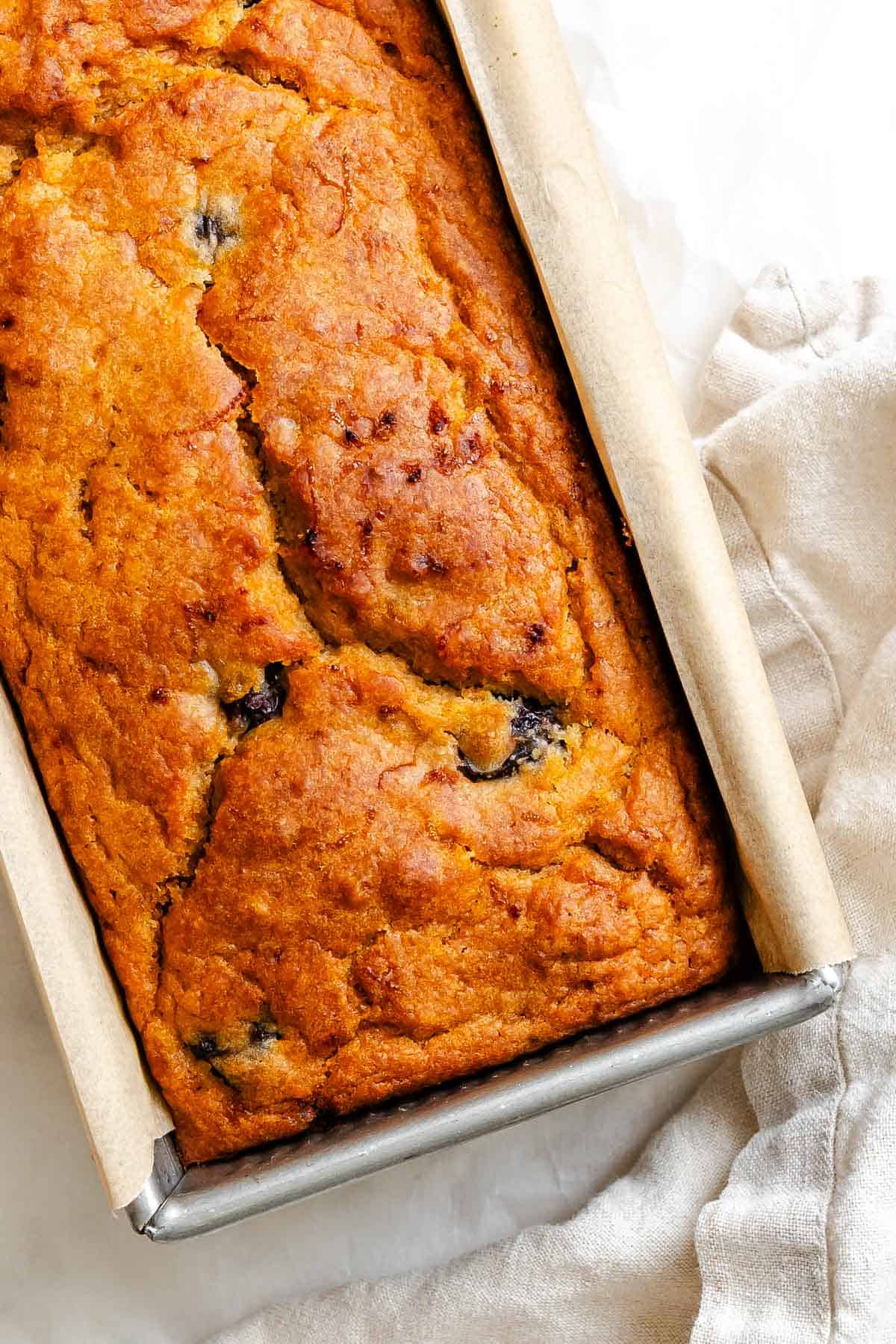Completed Cranberry Orange Bread (Eggless!) on white surface.
