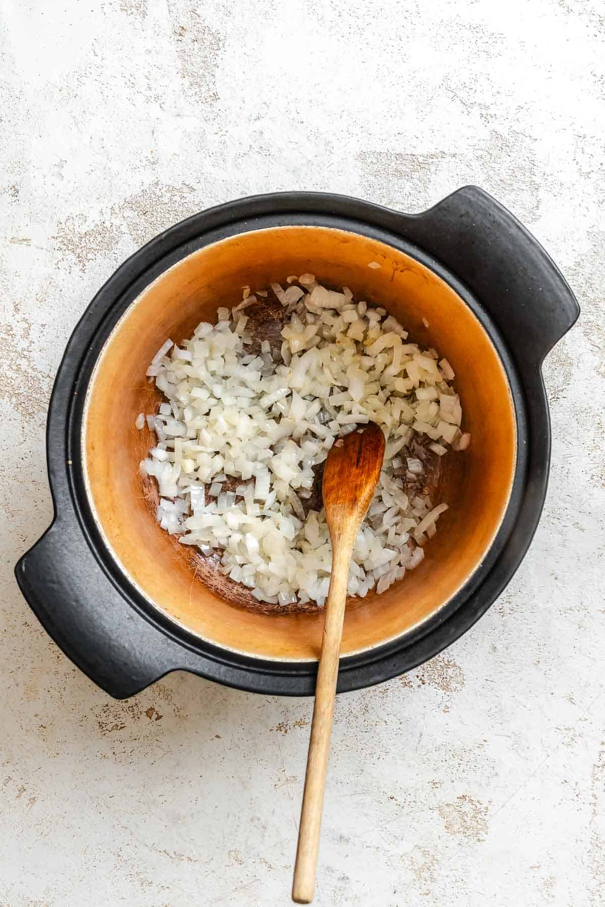 Process shot showing ingredients added to pot.