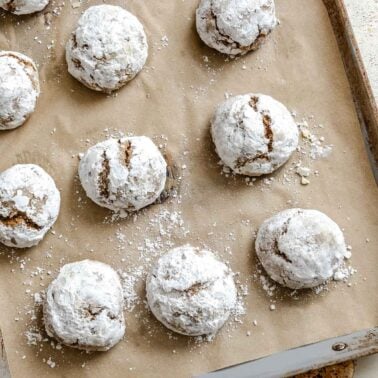 Completed Gingerbread Crinkle Cookies (Eggless!) on a baking dish.