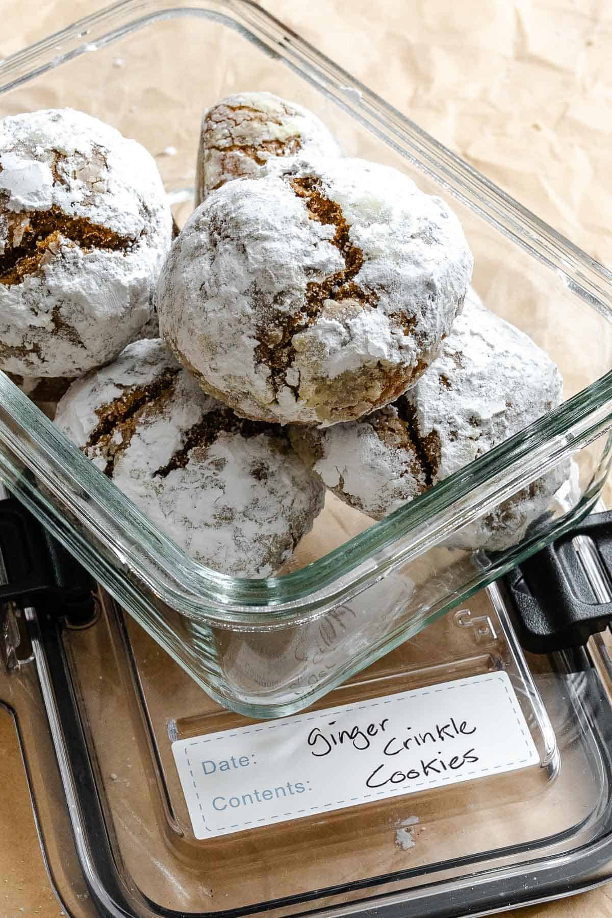 Completed Gingerbread Crinkle Cookies (Eggless!) in a storage container.