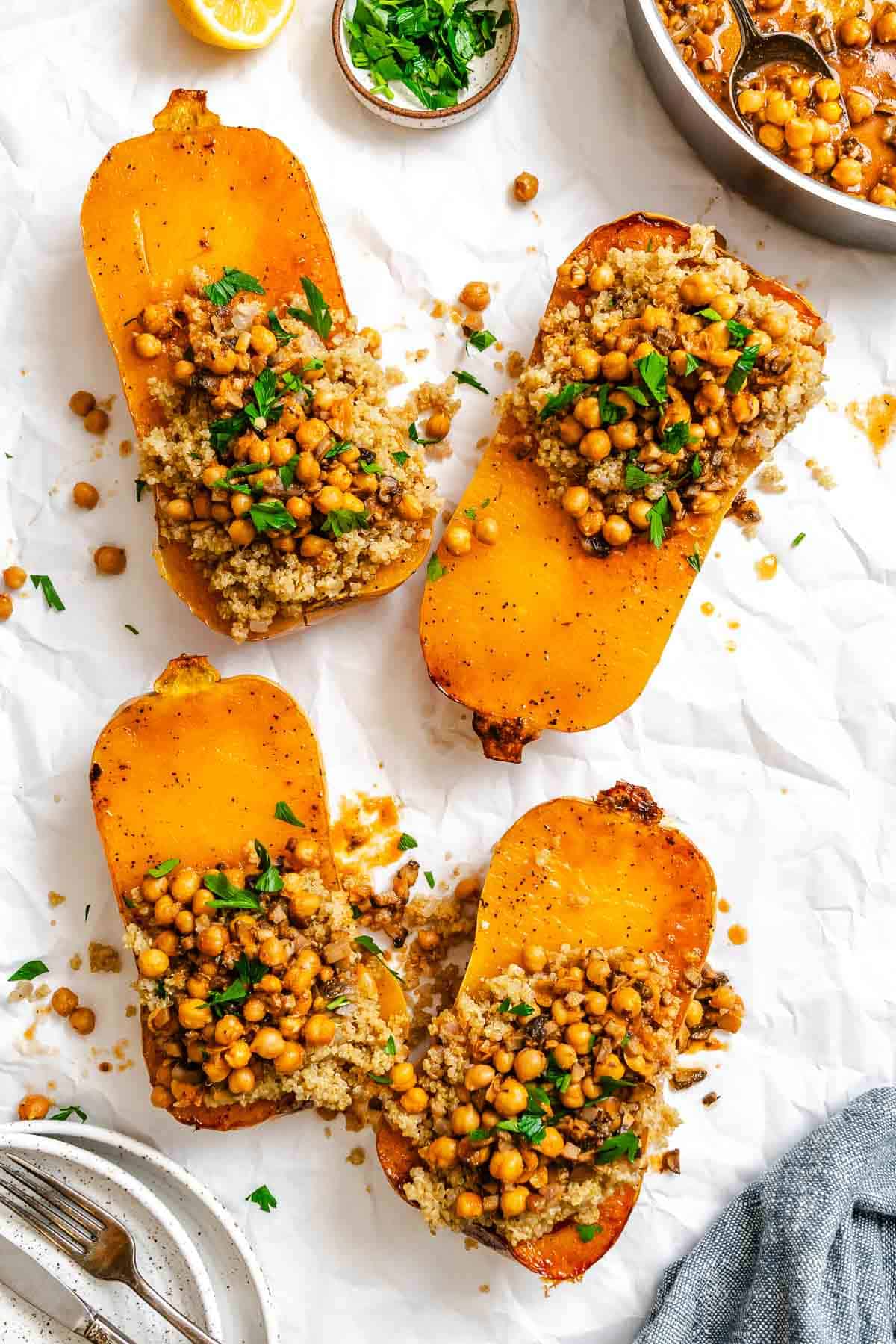 Process shot showing adding filling to butternut squash.