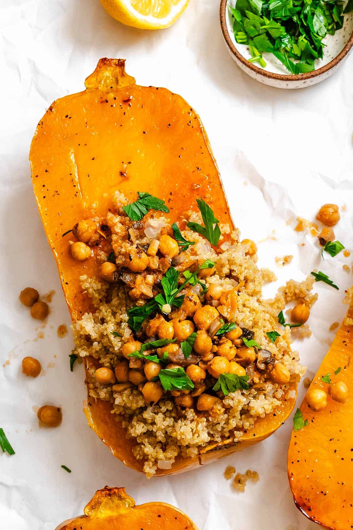 Completed Vegan Stuffed Butternut Squash on a white surface.