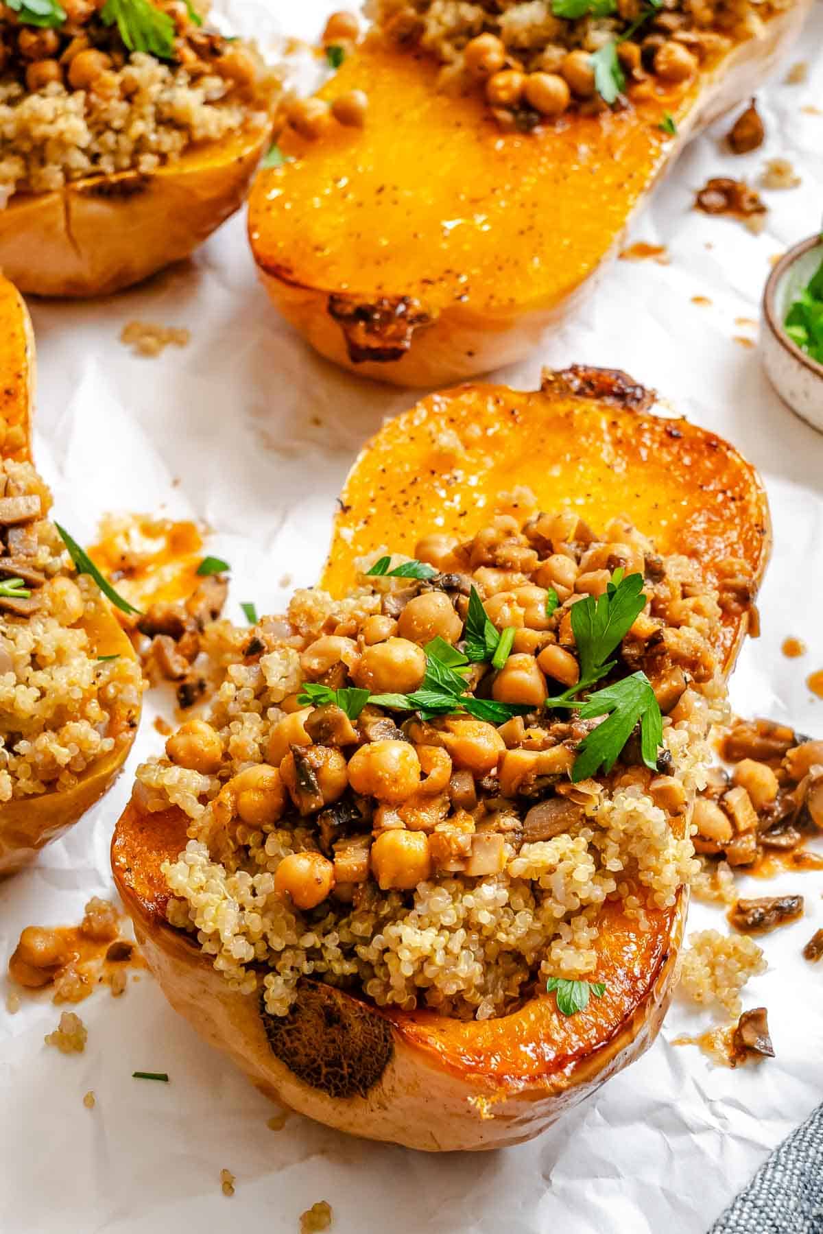 Completed Vegan Stuffed Butternut Squash on a white surface.