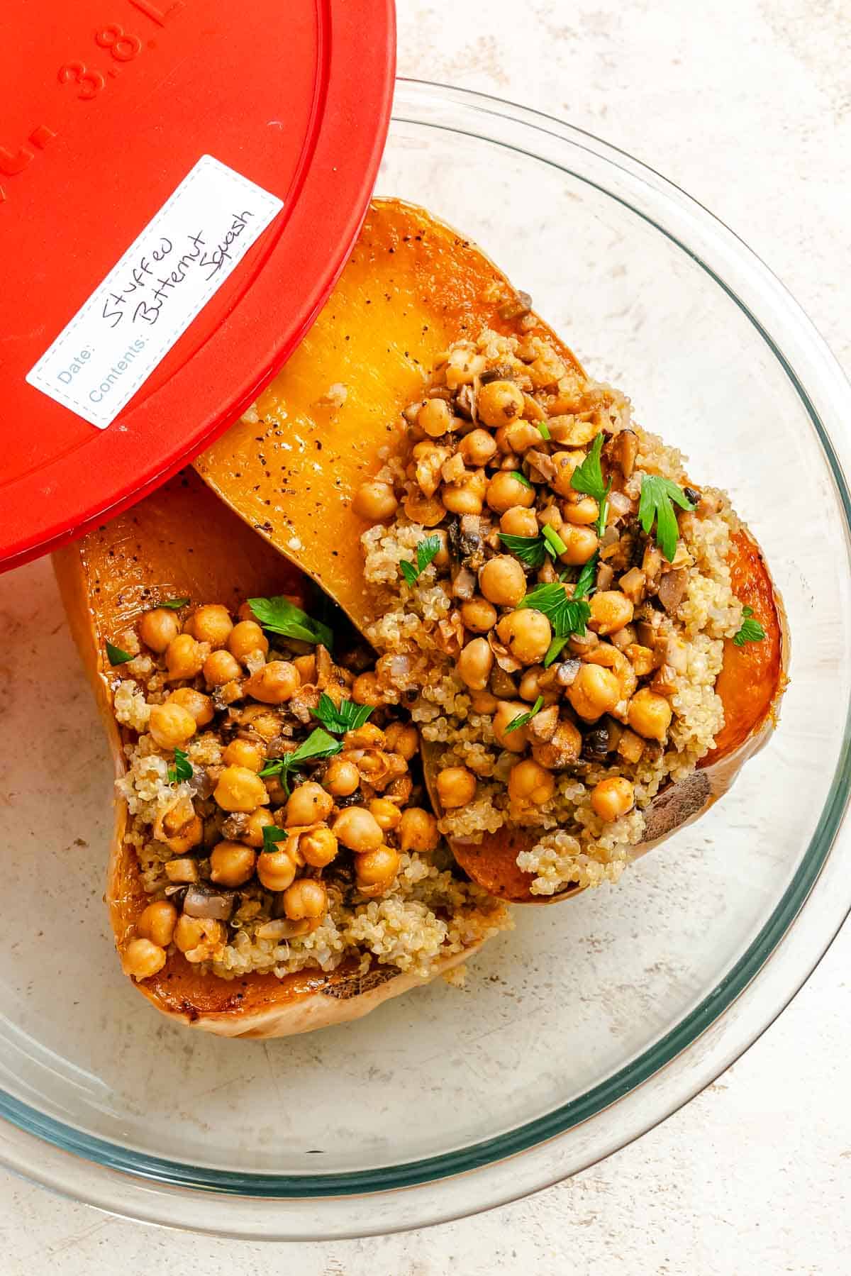 Completed Vegan Stuffed Butternut Squash in a storage container.