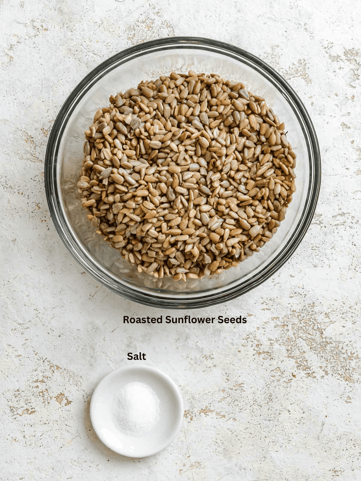 Ingredients for Sunflower Seed Butter measured out on a white surface.