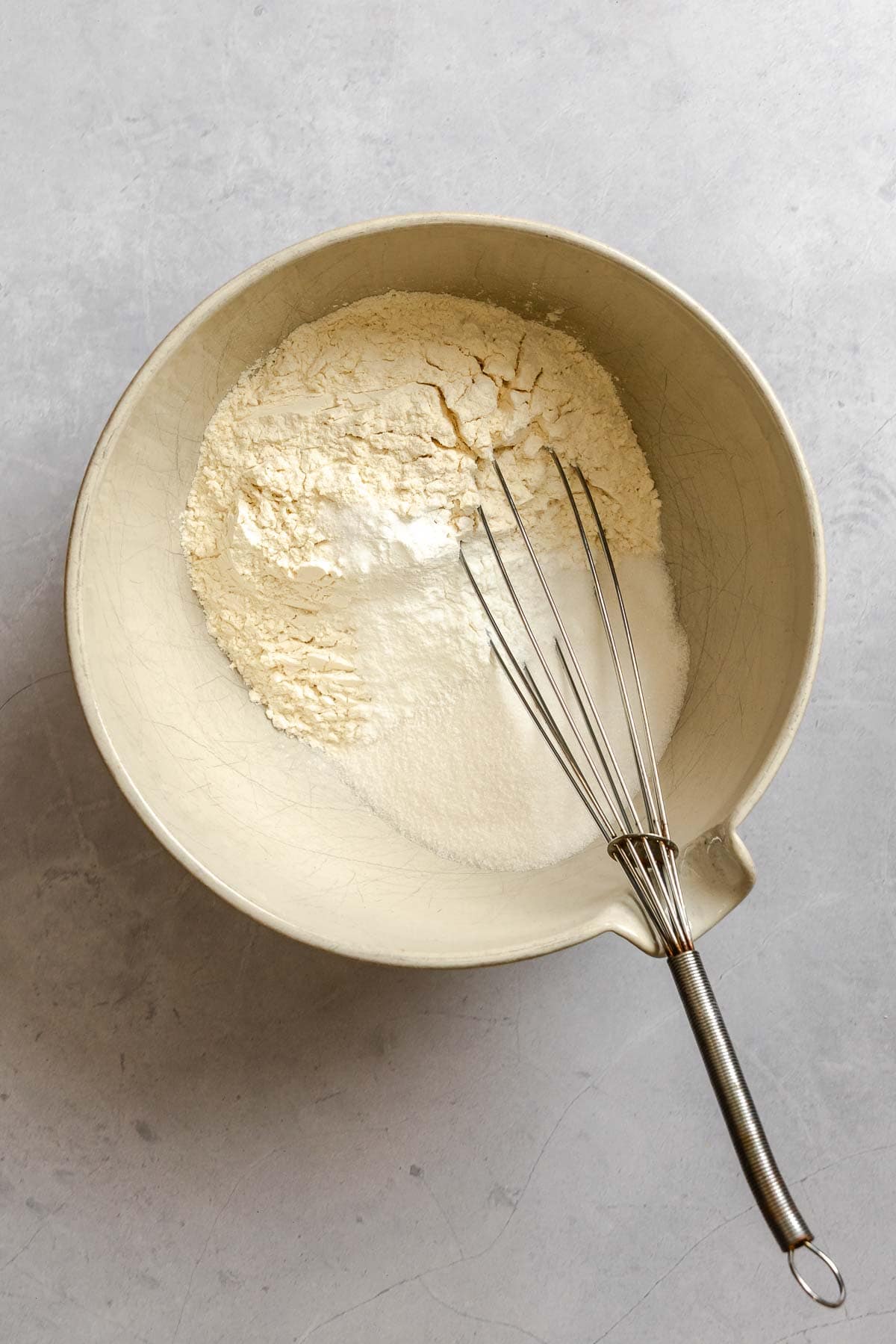 Process shot showing mixing ingredients in a bowl.