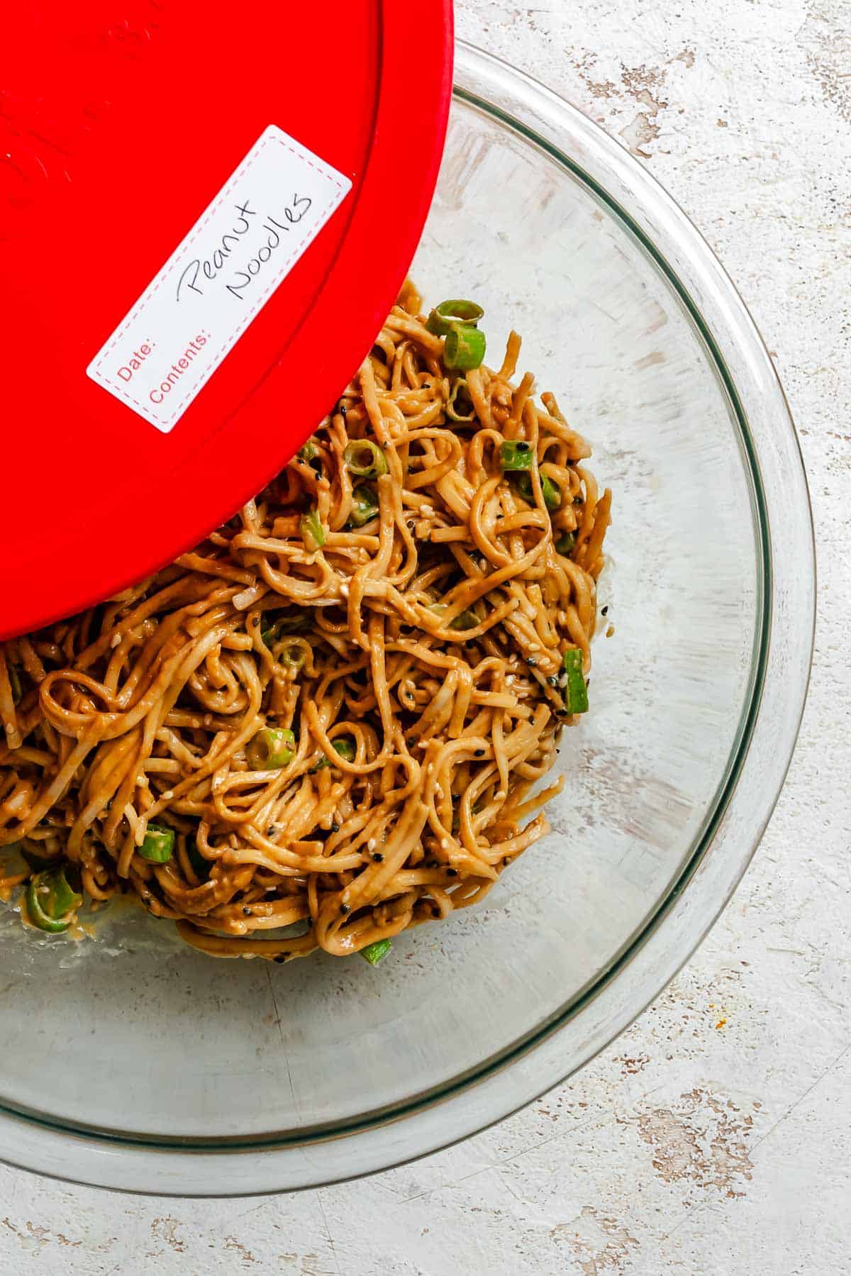 Completed Quick Peanut Noodles in a storage container.