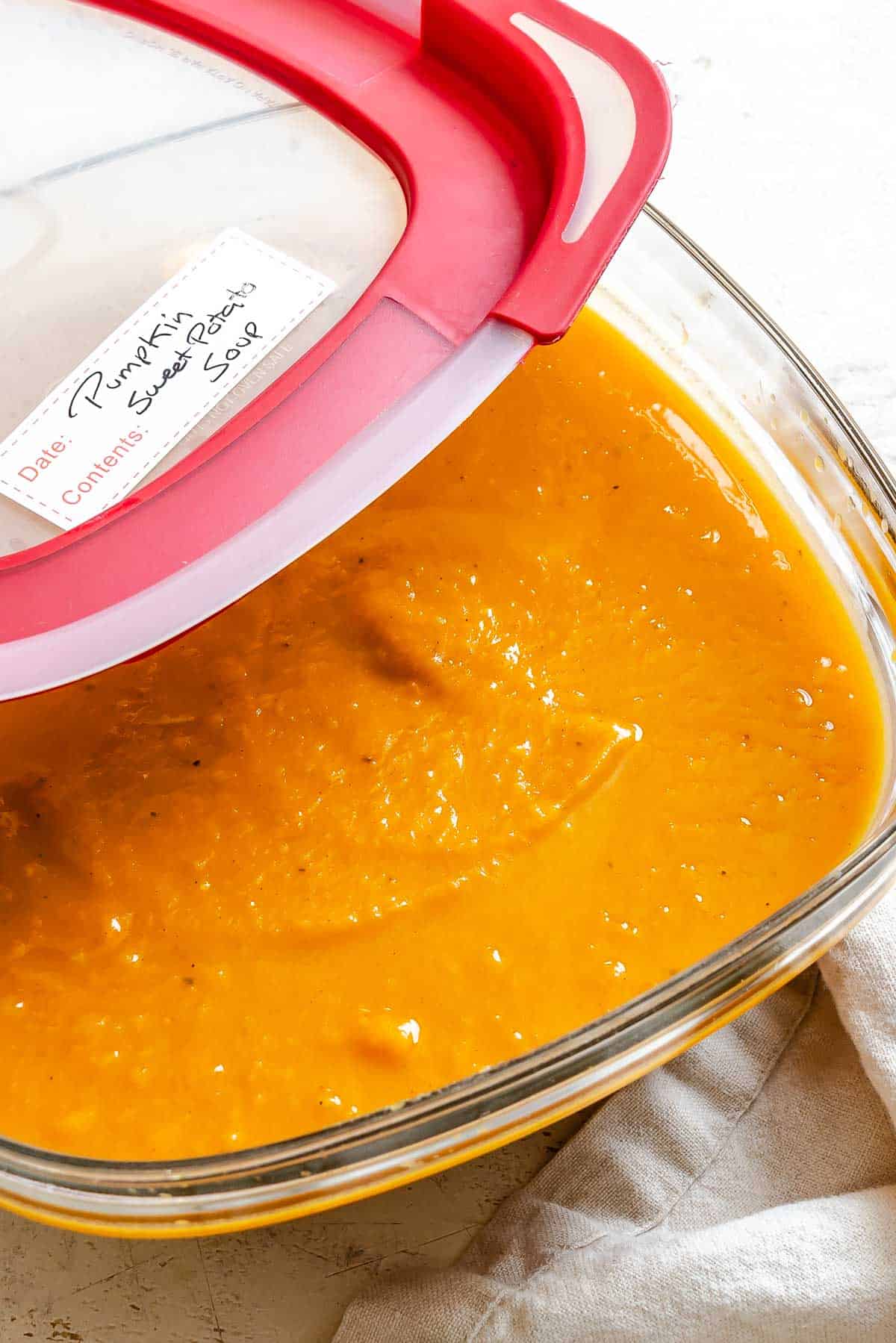 Completed Sweet Potato Pumpkin Soup in a storage container.